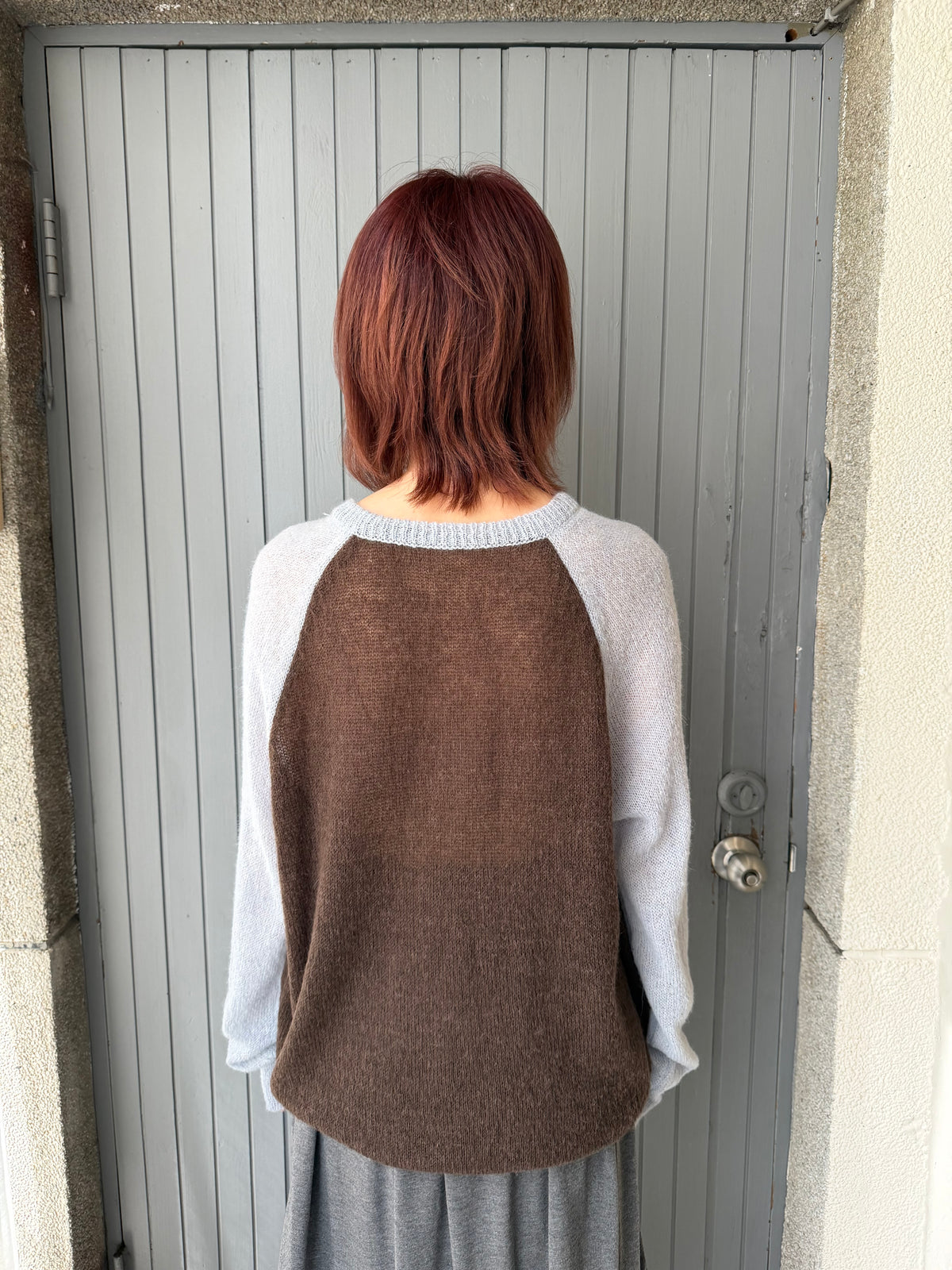 Henley collar knit raglan top