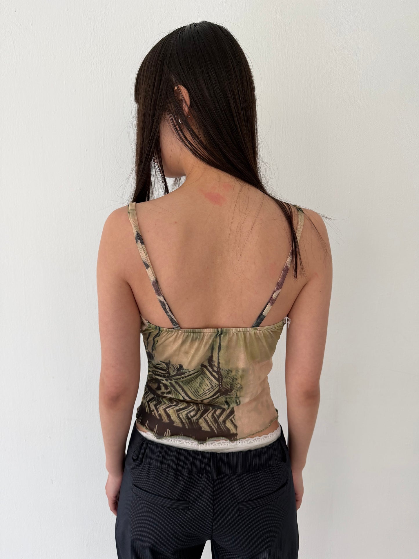 Sheer graphic buckle vest