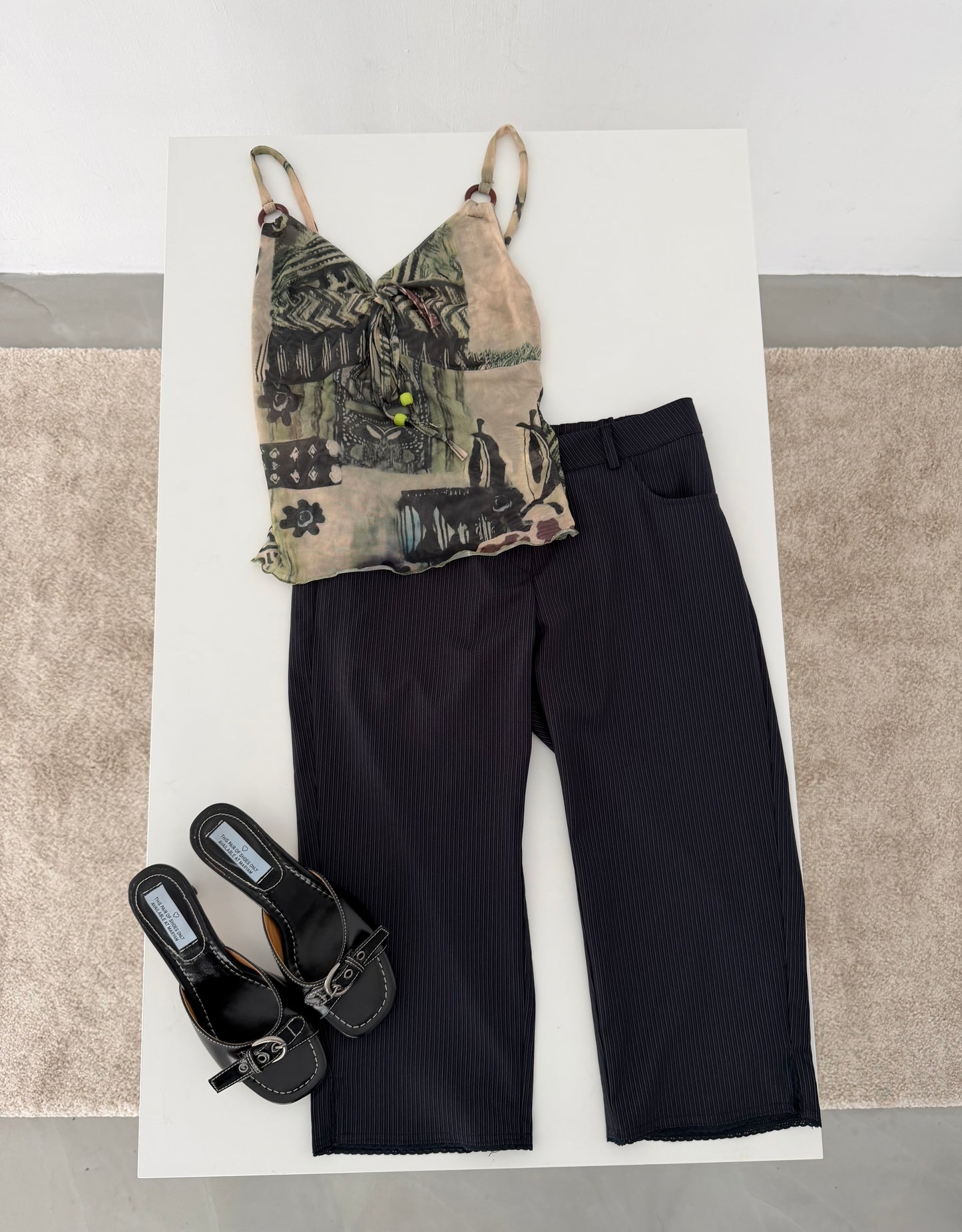 Sheer graphic buckle vest