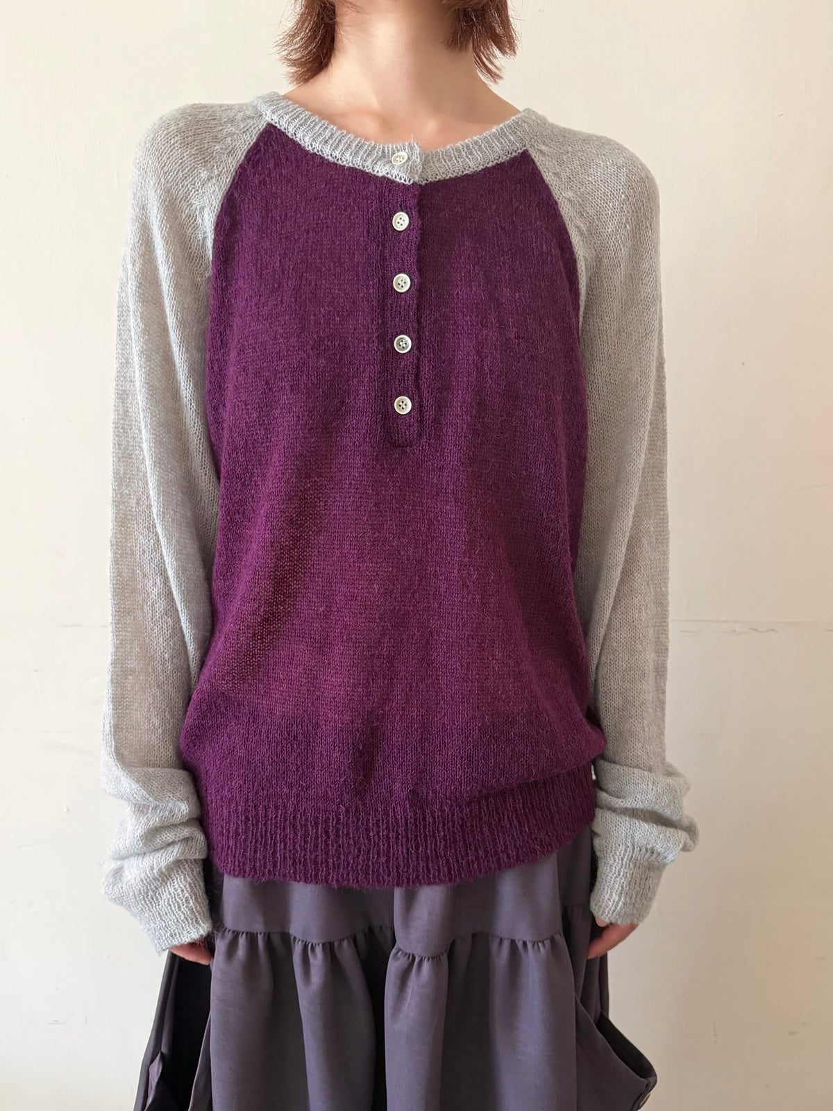 Henley collar knit raglan top