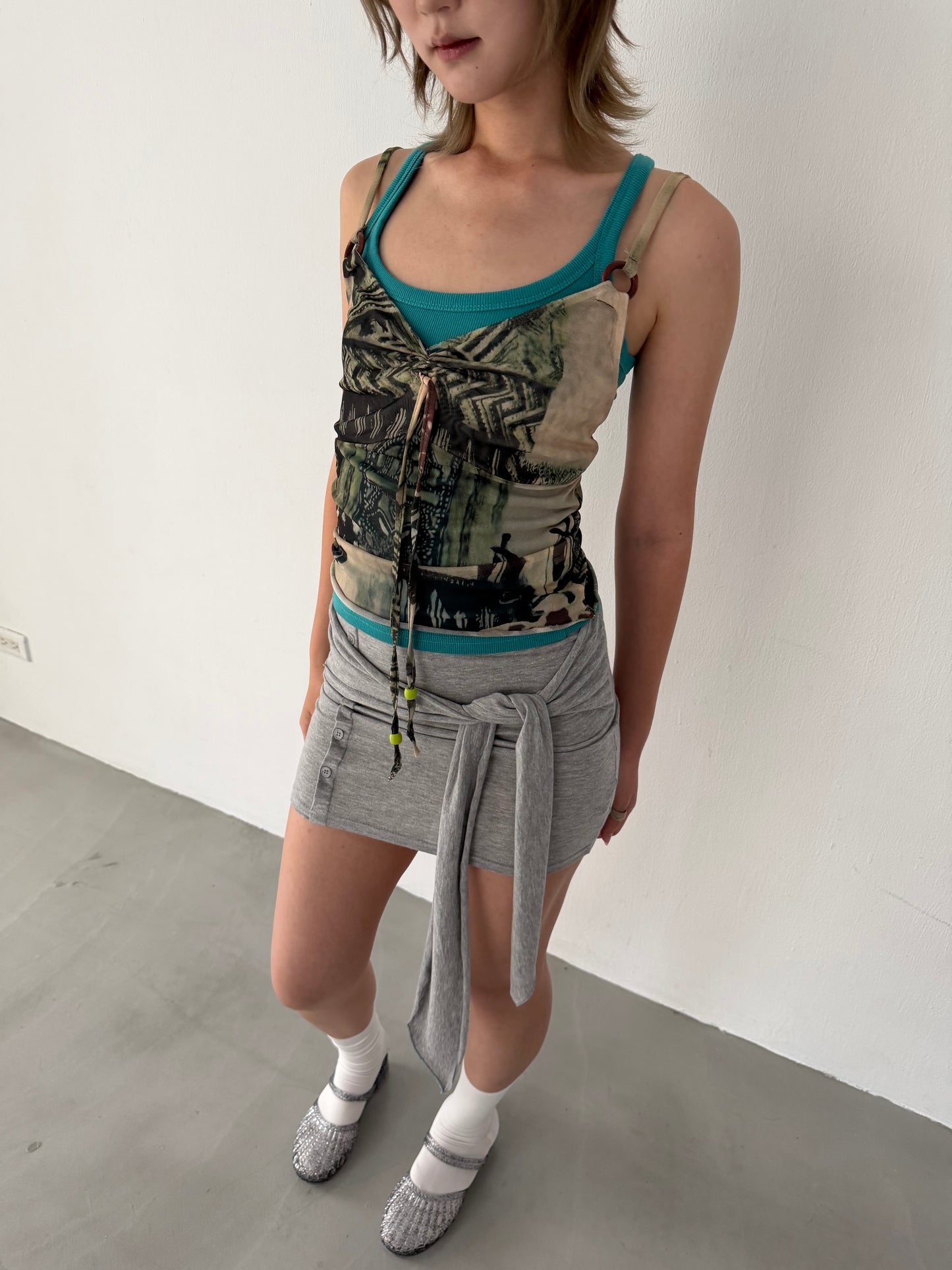 Sheer graphic buckle vest