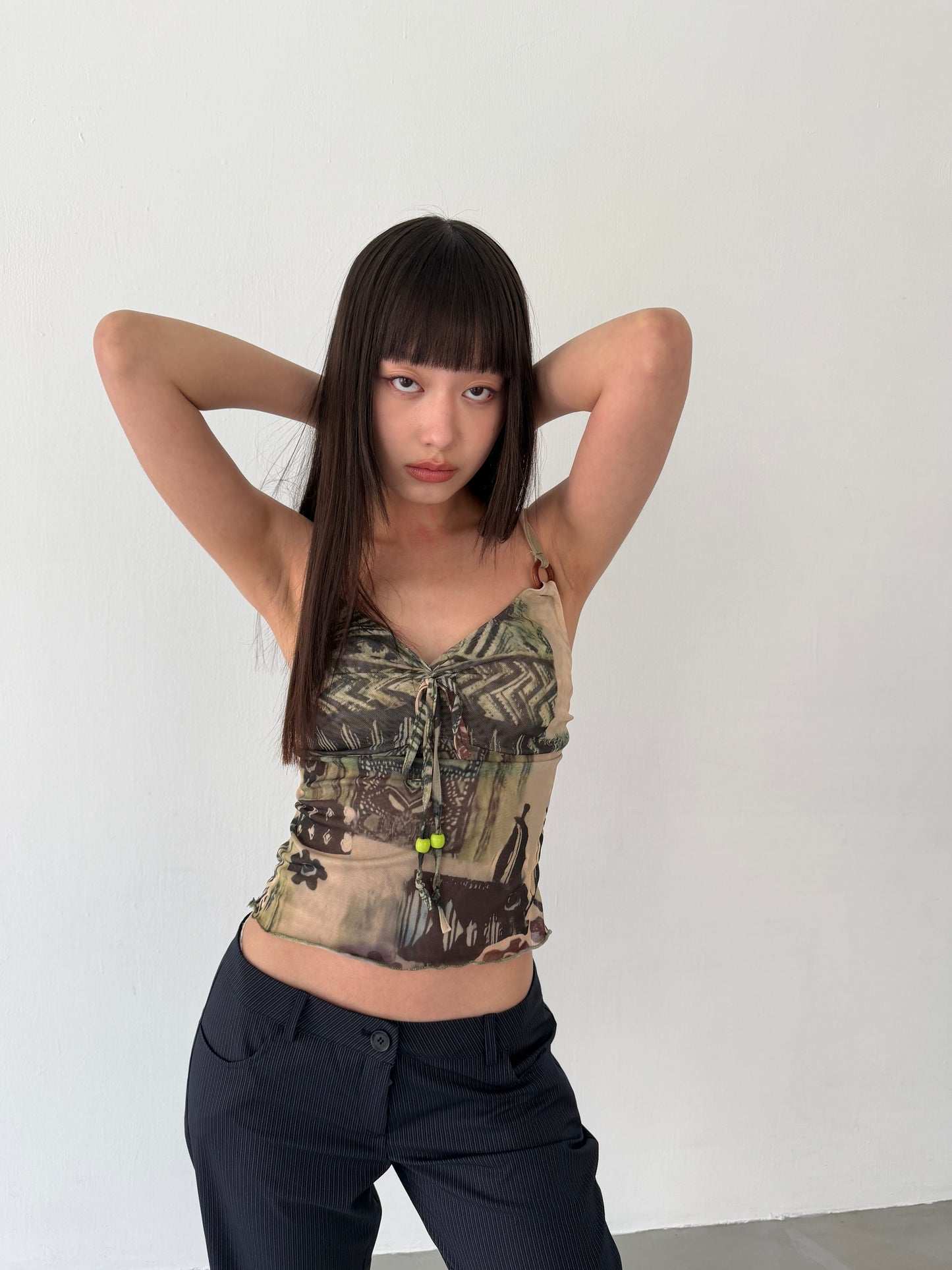 Sheer graphic buckle vest
